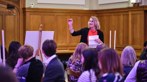 Professor Jan Godsell introduces the Distinguished Alumni Awards to a room of guests.